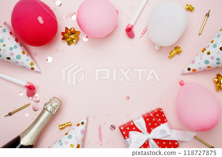 Birthday attributes colorful balloons, party hats, candles, and confetti. Concept of festive birthday celebrations 118727875