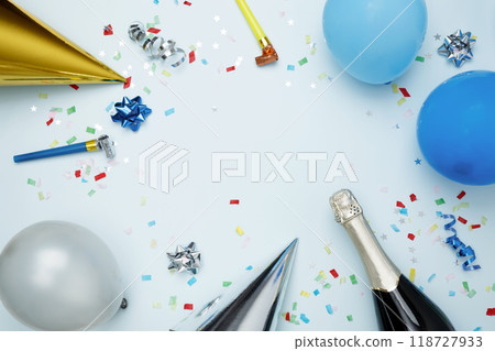Birthday attributes colorful balloons, party hats, candles, and confetti. Concept of festive birthday celebrations 118727933