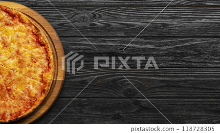 pizza margherita on black wooden table, top view, pizzeria concept 118728305