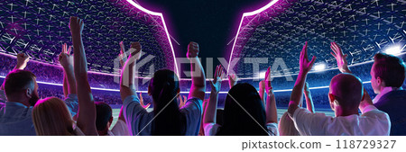 Brightly lit stadium filled with fans, with neon purple and pink lights illuminating arena. Fans energetically raise their hands toward field. Brightly lit stadium filled with fans, with neon purple and pink lights illuminating arena. Fans energetically raise their hands toward field. 118729327