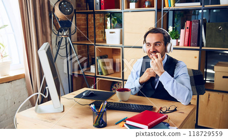 Nervously biting his nails, this businessman seems to be contemplating important decision or how to navigate difficult work problem. 118729559