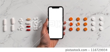 Black and colorful pills surrounding a smartphone on a white background. Black and colorful pills surrounding a smartphone on a white background. 118729934