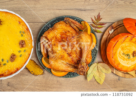 A Full Set Thanksgiving Dinner with turkey, potatoes soup, Pumpkin pie, decor with leaves. top view A Full Set Thanksgiving Dinner with turkey, potatoes soup, Pumpkin pie, decor with leaves. top view 118731092