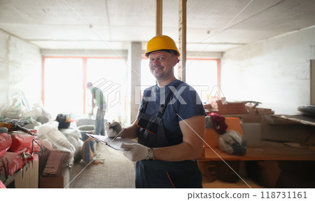 Smiling professional worker hold clipboard and list work materials Smiling professional worker hold clipboard and list work materials 118731161