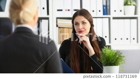 Man and smiling mature woman talking in office discuss working moment 118731169