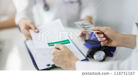 Patient give banknote money to doctor for marijuana recipe in hospital Patient give banknote money to doctor for marijuana recipe in hospital 118731187