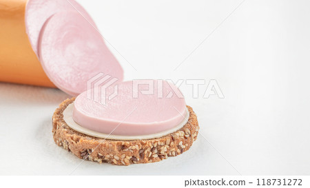tasty boiled sausage slices on whole grain bread, sandwich, copy space 118731272
