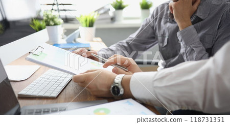 Boss reading new candidate application for work on vacant position in company 118731351