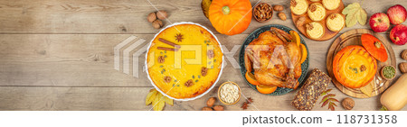 Festive dishes for Thanksgiving Day on wooden background, Long banner format. top view. copy space Festive dishes for Thanksgiving Day on wooden background, Long banner format. top view. copy space 118731358