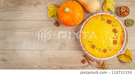 Baked Pumpkin Pie on wooden table. Homemade Thanksgiving Pie. top view. copy space Baked Pumpkin Pie on wooden table. Homemade Thanksgiving Pie. top view. copy space 118731359
