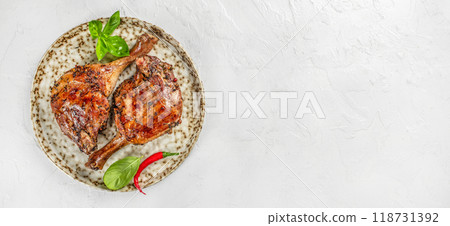 Grilled chicken legs with spices on plate. Long banner format. top view. copy space for text Grilled chicken legs with spices on plate. Long banner format. top view. copy space for text 118731392