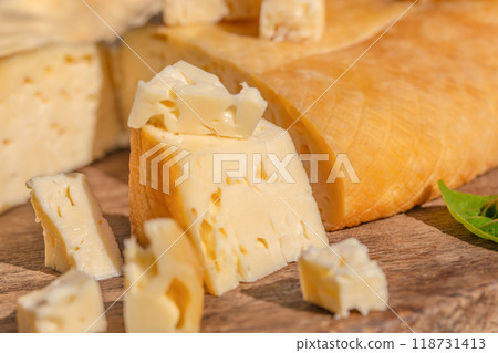 Board with tasty Swiss cheese. cheese platter for a tasting or appetizer 118731413