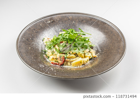 Italian Traditional potato gnocchi with smoked bacon, arugula, parmesan cheese. Top view. Copy space 118731494