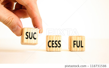 Successful symbol. Concept word Successful on beautiful wooden blocks. Businessman hand. Beautiful white background. Business successful concept. Copy space. Successful symbol. Concept word Successful on beautiful wooden blocks. Businessman hand. Beautiful white background. Business successful concept. Copy space. 118731586