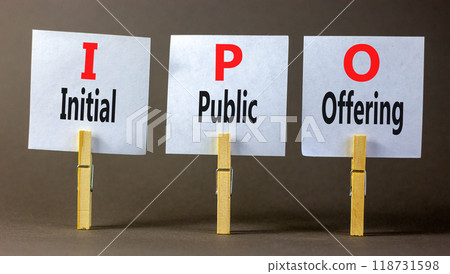 IPO initial public offering symbol. Concept words IPO initial public offering on beautiful white paper. Beautiful grey background. Business IPO initial public offering concept. Copy space. IPO initial public offering symbol. Concept words IPO initial public offering on beautiful white paper. Beautiful grey background. Business IPO initial public offering concept. Copy space. 118731598