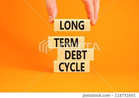 Long term debt cycle symbol. Concept words Long term debt cycle on beautiful wooden block. Beautiful orange table orange background. Businessman hand. Business Long term debt cycle concept. Copy space 118731601