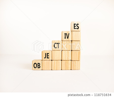 Objectives symbol. Concept word Objectives on beautiful wooden cubes. Beautiful white background. Business objectives concept. Copy space. Objectives symbol. Concept word Objectives on beautiful wooden cubes. Beautiful white background. Business objectives concept. Copy space. 118731634