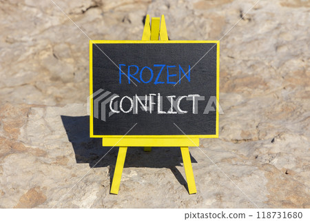 Frozen conflict symbol. Concept words Frozen conflict on beautiful black chalk blackboard on a beautiful stone background. Business and Frozen conflict concept. Copy space. Frozen conflict symbol. Concept words Frozen conflict on beautiful black chalk blackboard on a beautiful stone background. Business and Frozen conflict concept. Copy space. 118731680