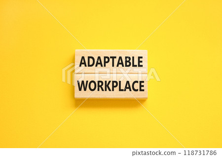 Adaptable workplace symbol. Concept words Adaptable workplace on beautiful wooden block. Beautiful yellow paper background. Business Adaptable workplace concept. Copy space. 118731786
