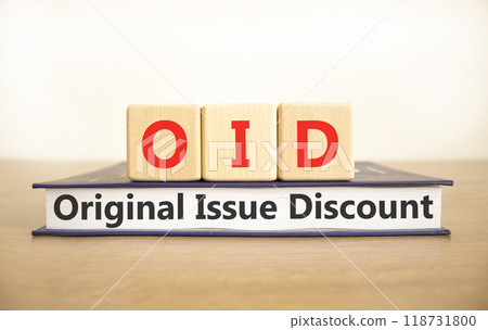 OID original issue discount symbol. Concept words OID original issue discount on beautiful wooden blocks and book. Beautiful white background. Business OID original issue discount concept. Copy space. 118731800