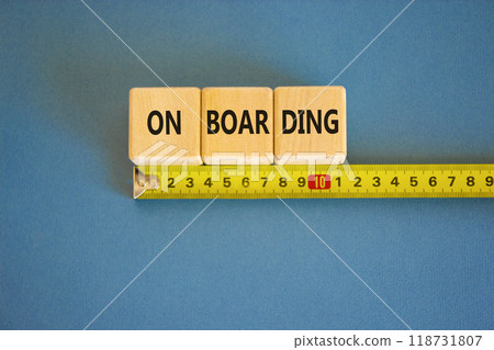 Onboarding success symbol. Concept word Onboarding on wooden blocks. Beautiful blue background. Beautiful yellow ruler. Business onboarding success concept. Copy space. 118731807