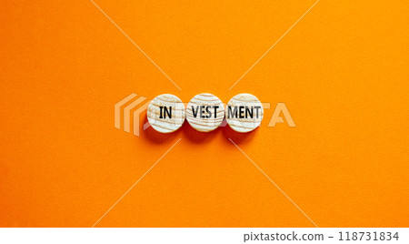 Investment symbol. Concept word Investment on beautiful wooden circles. Beautiful orange background. Business investment concept. Copy space. Investment symbol. Concept word Investment on beautiful wooden circles. Beautiful orange background. Business investment concept. Copy space. 118731834