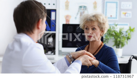 Professional doctor hold patients hand and calm down after appointment Professional doctor hold patients hand and calm down after appointment 118731967