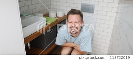 Man feeling relief after using toilet, fulfill natural need Man feeling relief after using toilet, fulfill natural need 118732019