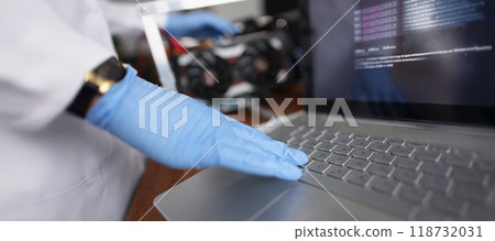Professional technician man touching laptop keyboard wearing sterile gloves 118732031