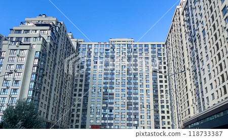 Large multi-storey residential building. Panorama. Urban architecture. Large multi-storey residential building. Panorama. Urban architecture. 118733387