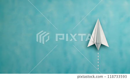 Paper airplane on a turquoise background. Copy space. 118733593