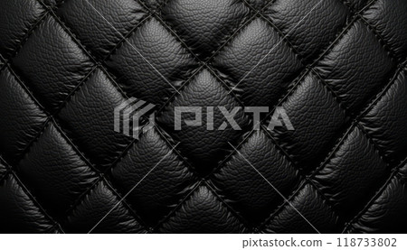 A close-up shot of quilted black leather texture with detailed stitching and a glossy surface. The image conveys luxury and elegance. 118733802