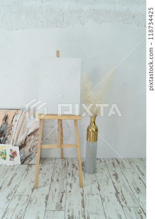 A Bright and Innovative Art Studio Featuring Beautiful Wooden Furniture along with Captivating Paintings 118734425