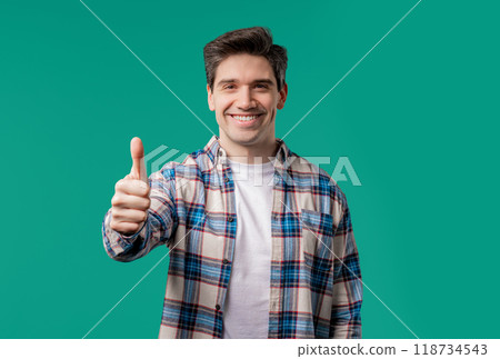 Positive smiling man with hand sign like, thumb up gesture.Happy hipster on blue 118734543