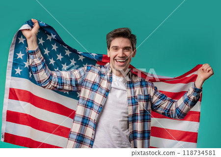 Happy mature man with national USA flag on blue background. American patriot Happy mature man with national USA flag on blue background. American patriot 118734581