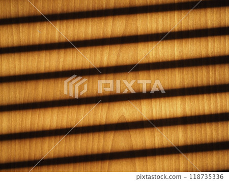 blinds shadow on wooden wall background 118735336