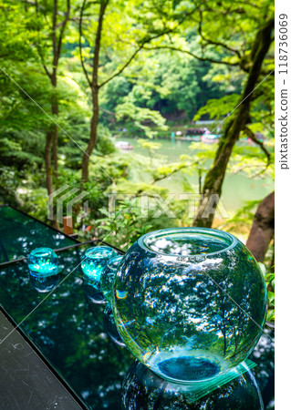 Japanese garden view with reflection and flowers, in Arashiyama Kyoto, Japan Japanese garden view with reflection and flowers, in Arashiyama Kyoto, Japan 118736069