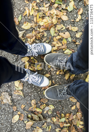 Upper look at the feet of both man and woman 118736475