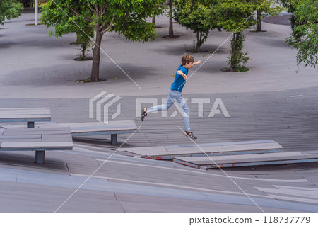 Teenage boy doing parkour in a park. Adventure, movement, and urban sport concept 118737779