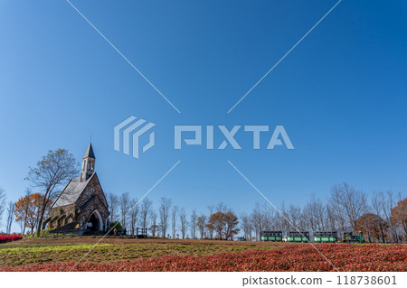 A church and a train seen beyond the flower fields of Hirugano Plateau Pastoral Village in autumn, Gujo City, Gifu Prefecture A church and a train seen beyond the flower fields of Hirugano Plateau Pastoral Village in autumn, Gujo City, Gifu Prefecture 118738601