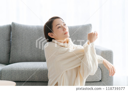 A woman relaxing in the room 118739377