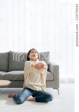 A woman relaxing in the room 118739383