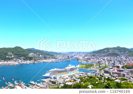 Nagasaki city and a luxury cruise ship anchored at Nagasaki Port 118740189
