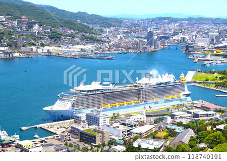 Nagasaki city and a luxury cruise ship anchored at Nagasaki Port Nagasaki city and a luxury cruise ship anchored at Nagasaki Port 118740191