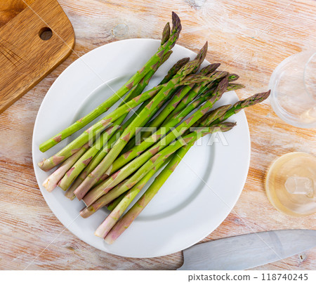 Fresh green asparagus served at table 118740245