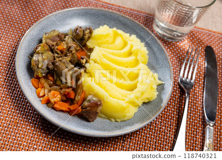 Mashed puree potatoes with fried chicken in vegetable gravy. Mashed puree potatoes with fried chicken in vegetable gravy. 118740321