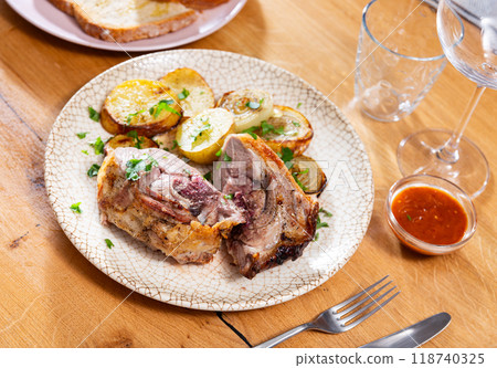 Grilled lamb chops with potatoes, onions and sauce Grilled lamb chops with potatoes, onions and sauce 118740325