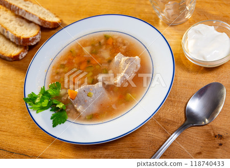 Homemade rassolnik from pickled cucumbers with sour cream and greens Homemade rassolnik from pickled cucumbers with sour cream and greens 118740433