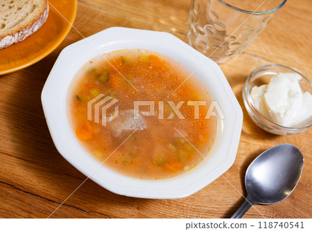 Popular Russian soup rassolnik with pickled cucumbers, brine and pearl barley served in plate 118740541