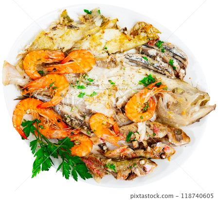 Deep-fried fish carcasses are served on plate - assorted Atlantic sea fish and shrimp Deep-fried fish carcasses are served on plate - assorted Atlantic sea fish and shrimp 118740605